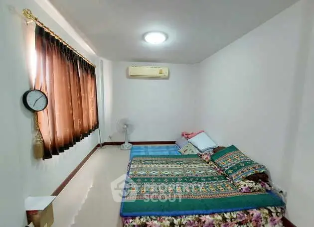 Cozy bedroom with air conditioning and natural light