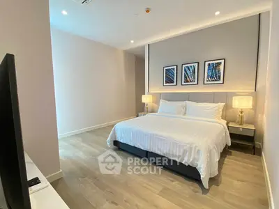 Spacious modern bedroom with elegant decor and cozy lighting