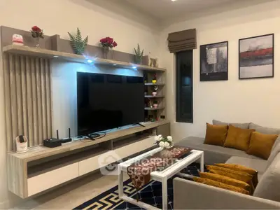 Modern living room with stylish TV unit and cozy seating area