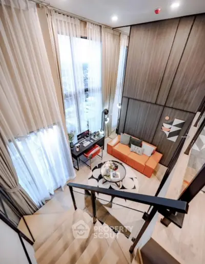 Stunning modern duplex living room with high ceilings and elegant decor