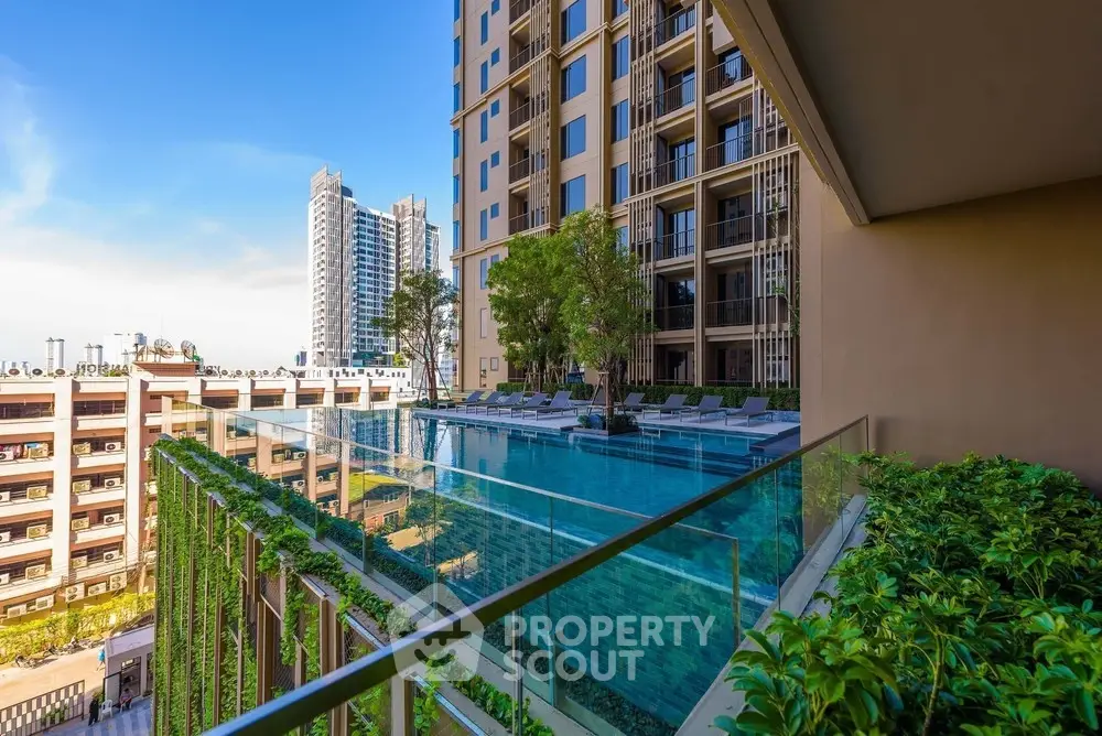 Luxurious high-rise building with stunning pool and city view