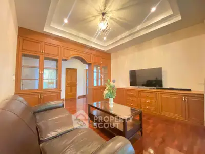 Elegant living room with wooden cabinetry and modern lighting