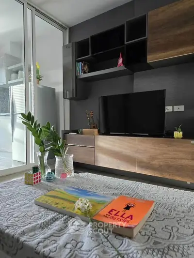 Modern living room with stylish wooden TV unit and cozy decor