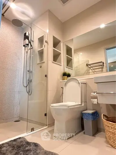 Modern bathroom with glass shower and sleek fixtures