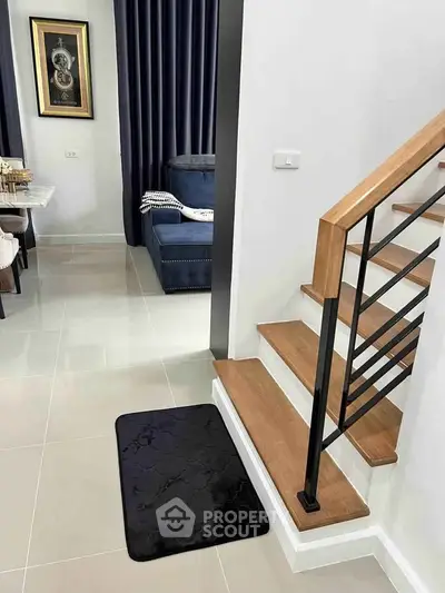 Modern interior with stylish staircase and cozy living area