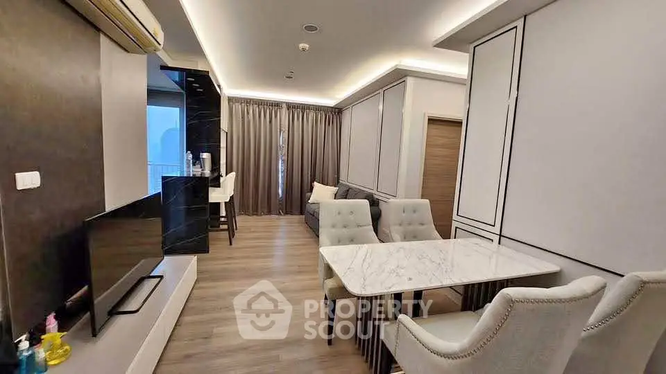 Modern living room with elegant dining area and stylish decor