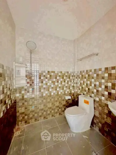 Modern bathroom with stylish tile design and sleek fixtures