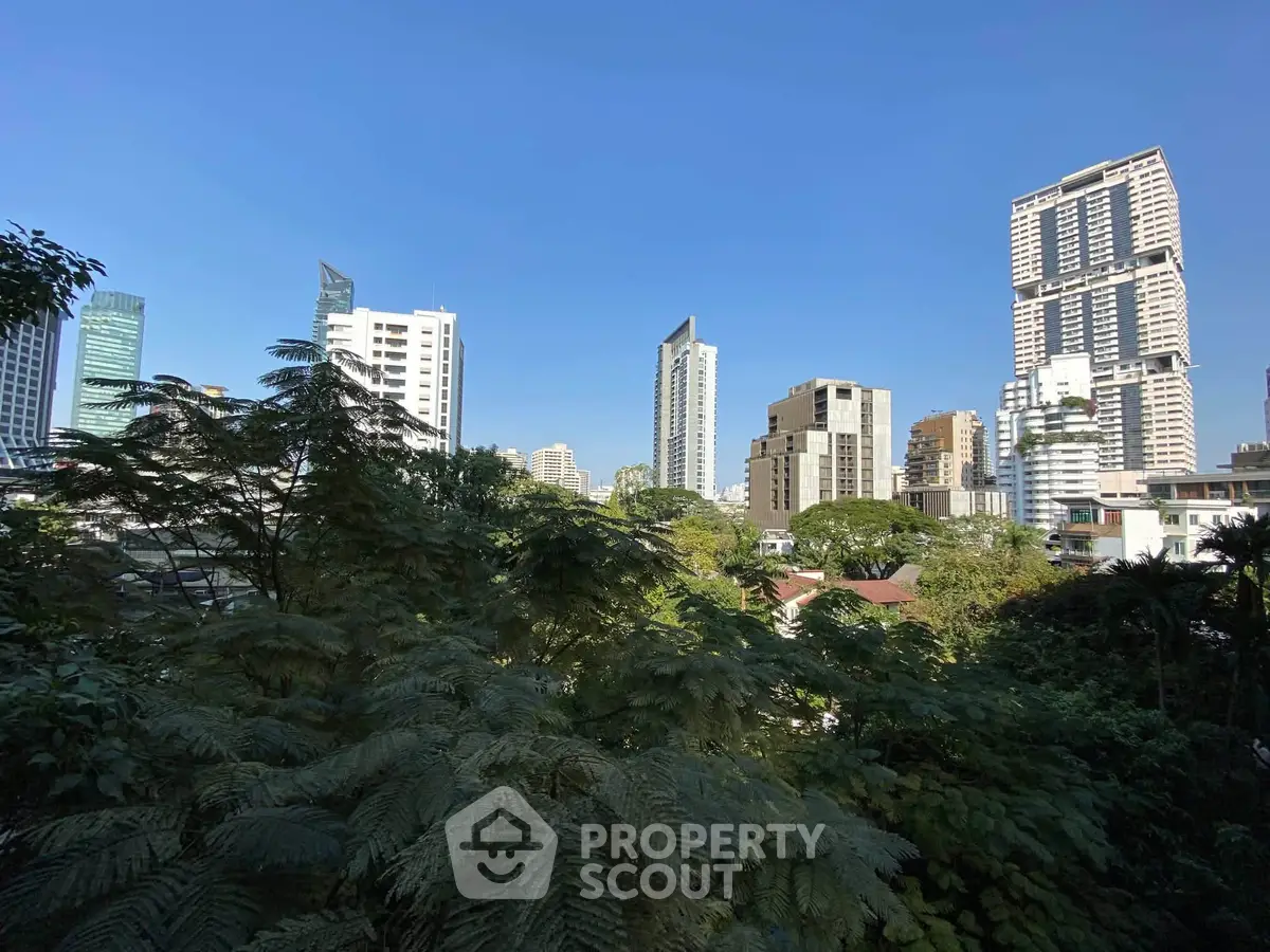 Stunning cityscape view with modern high-rise buildings and lush greenery, perfect for urban living enthusiasts.