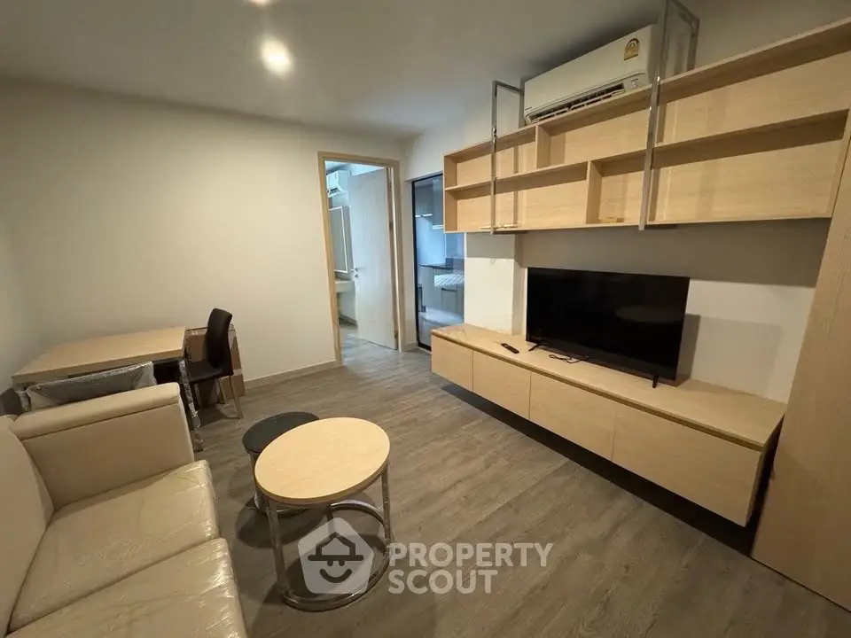 Modern living room with sleek furniture and open layout, perfect for urban living.