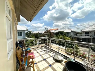 Spacious balcony with scenic neighborhood view and outdoor seating