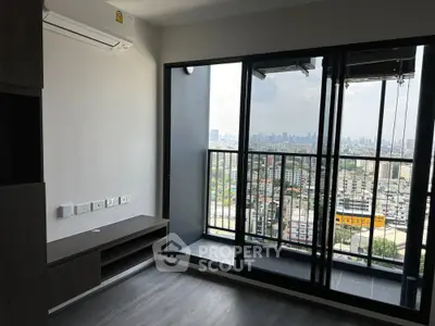 Modern high-rise apartment with stunning city view and spacious balcony