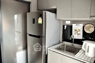 Modern kitchen with sleek appliances and stylish cabinetry