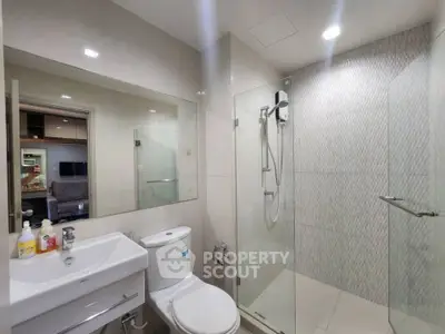 Modern bathroom with glass shower and sleek fixtures