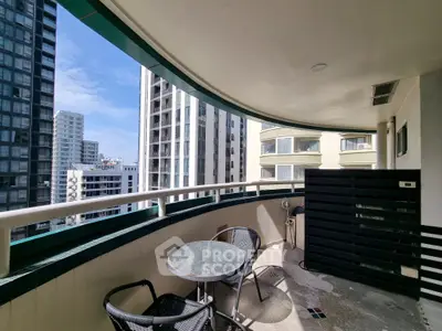 Spacious balcony with city view, perfect for outdoor relaxation and dining.