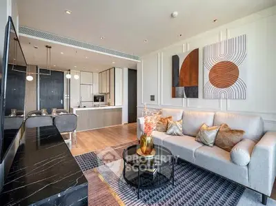 Luxurious modern living room with open kitchen, stylish decor, and elegant furniture in a high-end apartment.