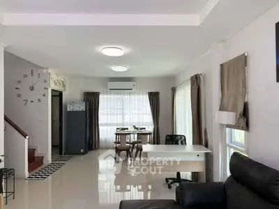 Spacious modern living room with dining area and natural light
