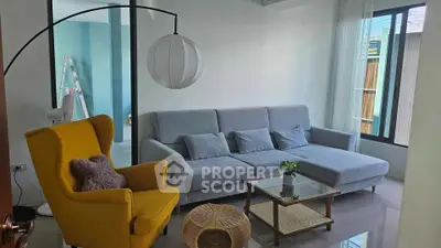 Modern living room with stylish furniture and natural light