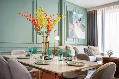 Elegant dining area with stylish decor and modern furnishings in a luxurious living room setting.