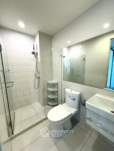 Modern bathroom with glass shower and sleek fixtures