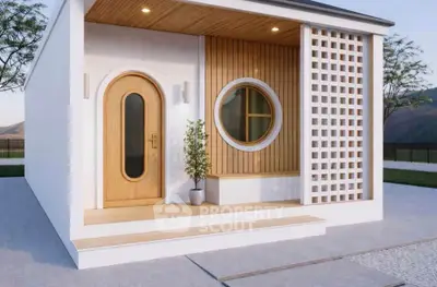 Modern minimalist house exterior with unique circular window and wooden accents