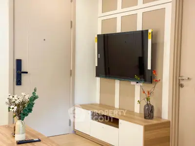Modern living room with mounted TV and stylish decor