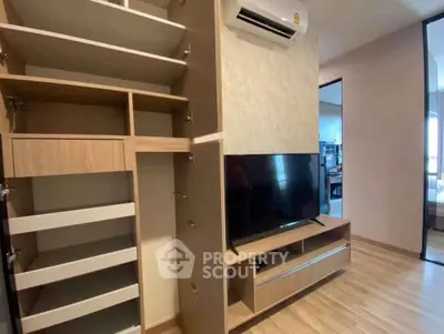Modern living room with built-in storage and sleek TV setup
