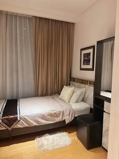 Cozy bedroom with single bed and elegant decor in modern apartment.