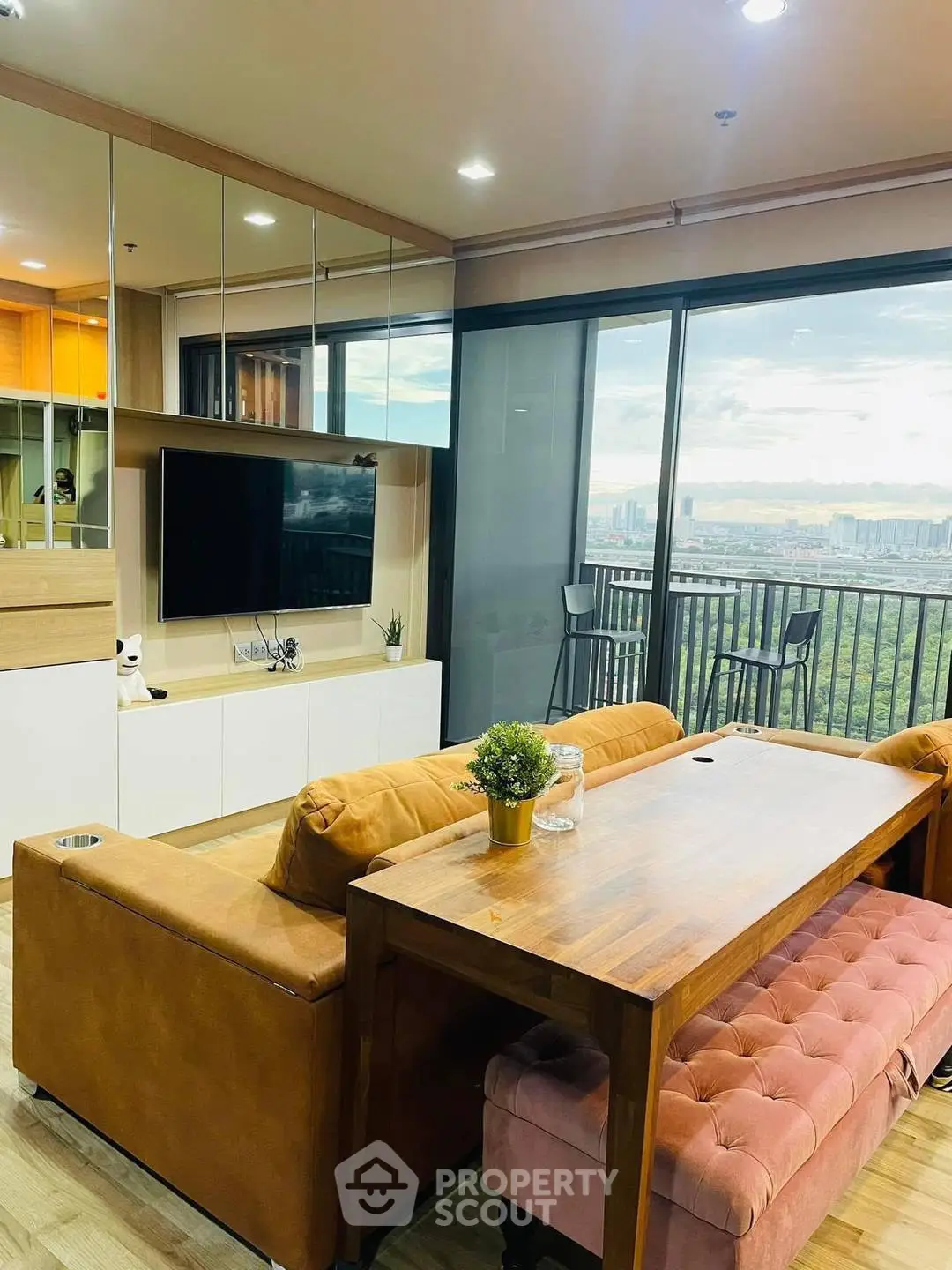 Modern living room with panoramic city view and stylish furniture