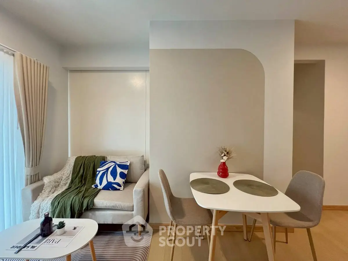 Modern living room with cozy dining area and stylish decor