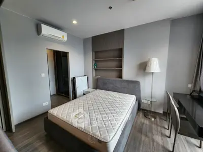 Modern bedroom with sleek design and air conditioning in a stylish apartment.