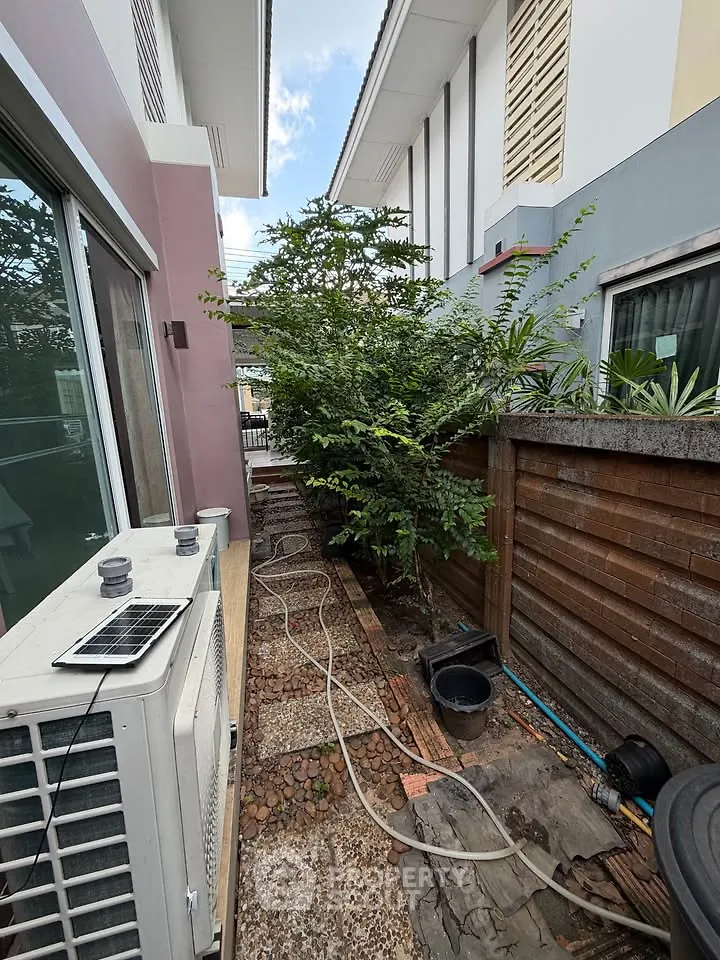 Charming outdoor garden space with lush greenery and modern exterior design, perfect for relaxation and privacy.