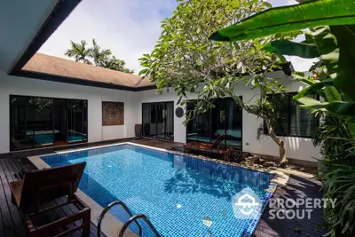 Luxurious villa with private pool and lush garden, perfect for tropical living.