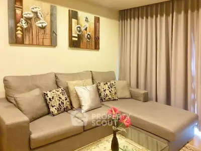 Cozy living room with elegant sofa and stylish decor, perfect for relaxation and entertaining.