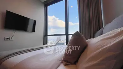 Luxurious bedroom with stunning city view and modern decor