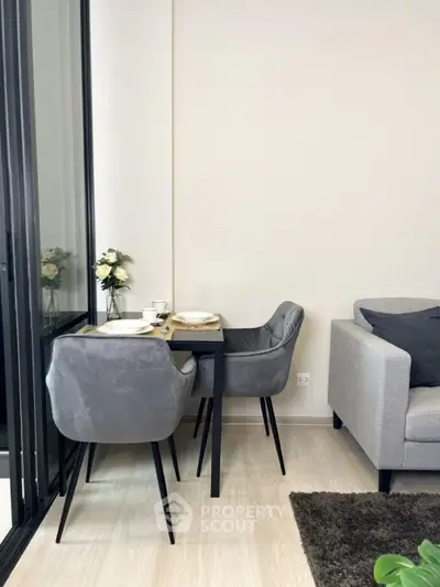 Modern living room with stylish dining area and cozy seating