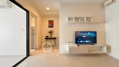 Modern living room with wall-mounted TV and minimalist decor
