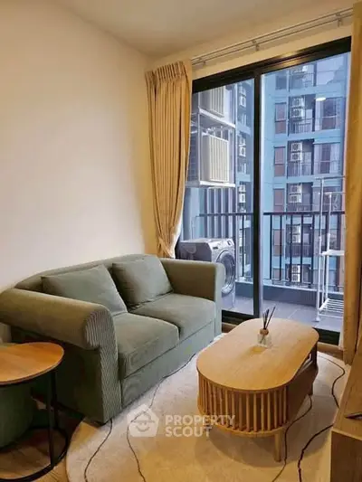 Cozy living room with modern sofa and balcony view in urban apartment