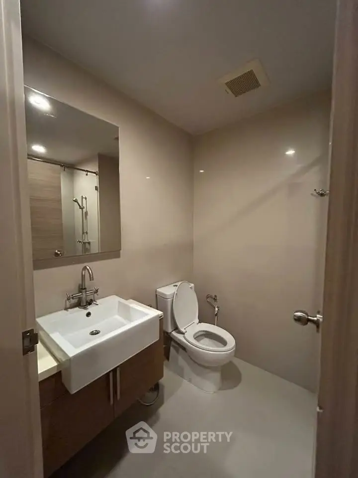 Modern bathroom with sleek fixtures and neutral tones
