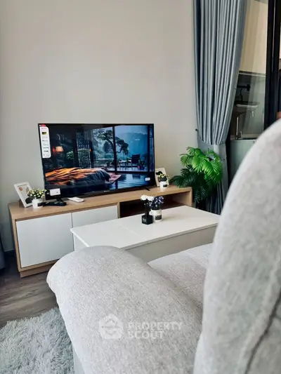 Modern living room with cozy sofa and stylish TV setup