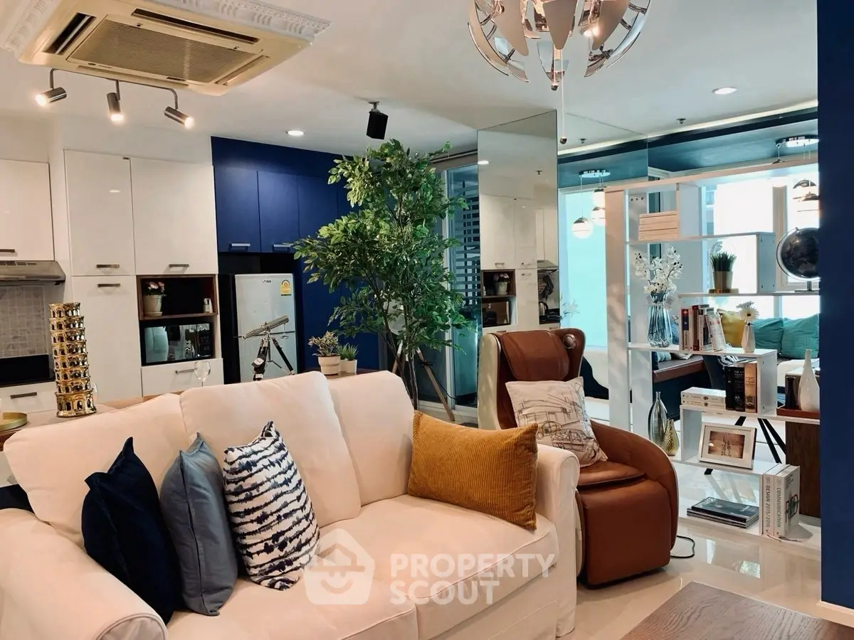 Stylish modern living room with cozy seating and elegant decor in a contemporary apartment.