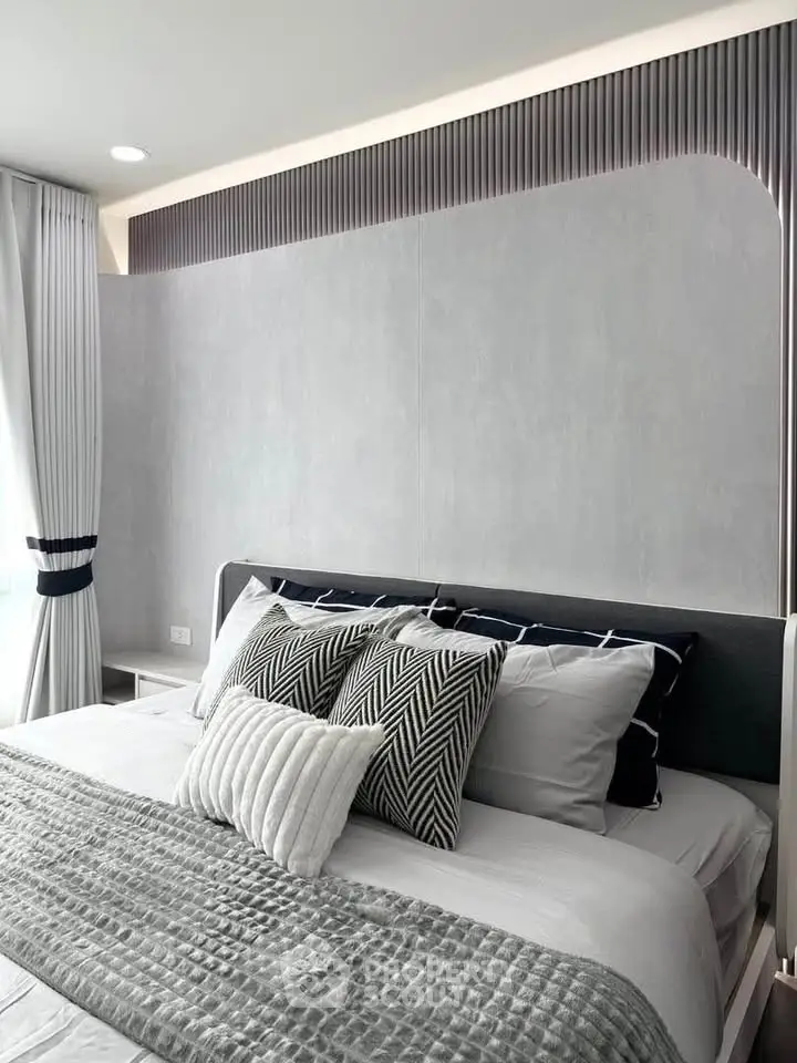 Modern bedroom with stylish decor and elegant bedding