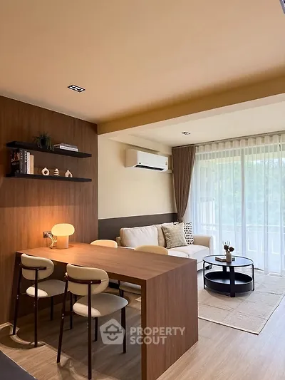 Modern living room with stylish furniture and large window for natural light