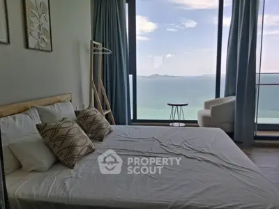 Luxurious bedroom with stunning ocean view and modern decor