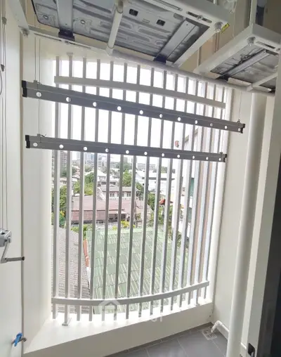 Modern balcony with sleek vertical railings and city view