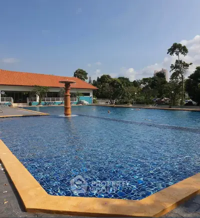 Luxurious outdoor pool with clear blue water and scenic surroundings, perfect for relaxation and leisure.