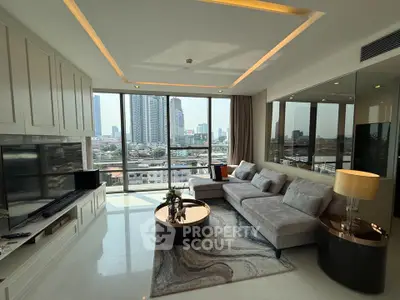 Luxurious living room with stunning city view, modern furniture, and elegant decor in high-rise apartment.