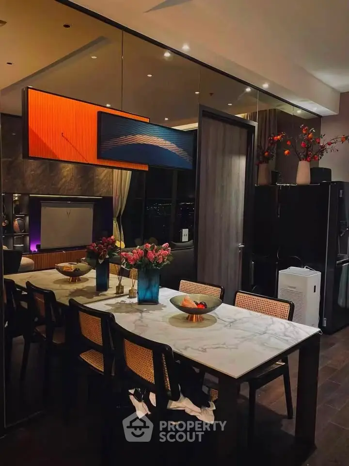 Luxurious dining area with elegant marble table and modern decor in a stylish apartment.