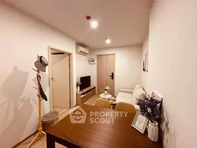 Cozy living room with modern decor and wooden furniture, perfect for relaxation and entertainment.