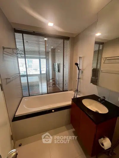 Modern bathroom with sleek design and bathtub in a luxury apartment