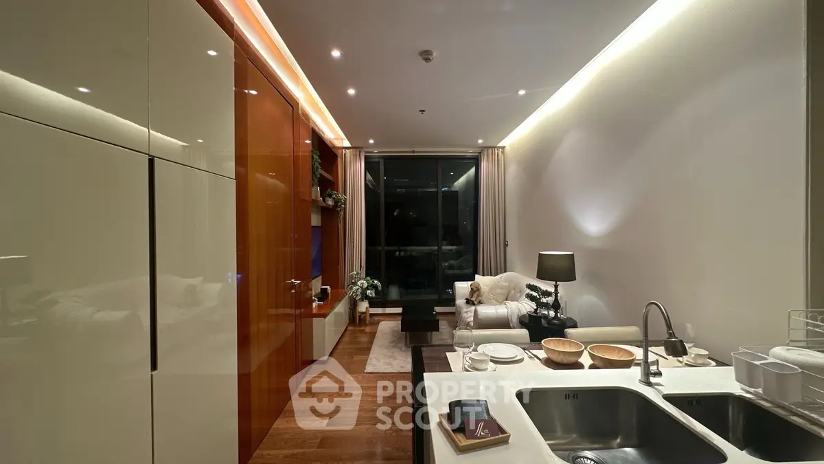 Modern living room with open kitchen, sleek design, and cozy ambiance